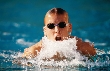 Photograph of a swimmer as his head comes up for a breath of air