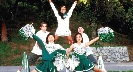 Photograph of a group of cheerleaders doing a routine