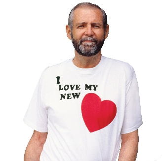 Photograph of a man wearing a T-shirt with “I love my new heart” on it