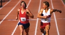 Photograph of two runners reaching the finish line