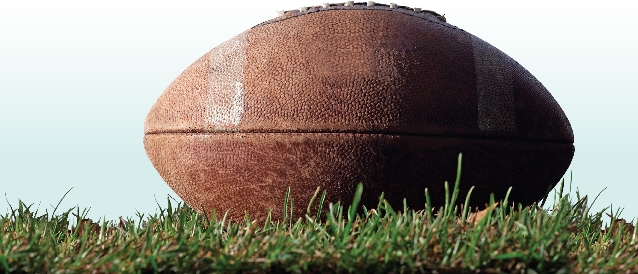 Photograph of a football laying in the grass