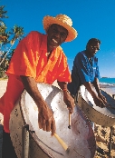 Photograph of two men playing steel drums