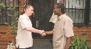 Photograph of two men shaking hands