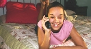 Photograph of a teenage girl talking on the telephone