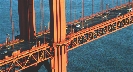 Photograph of cars on the roadway of a bridge