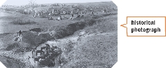 This historical photograph shows a Lakota Native American camp in South Dakota, around 1890. As more people traveled westward through Native American land, contact between Native Americans and settlers became more unfriendly.