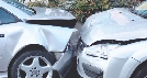 Photograph of two damaged cars involved in a collision