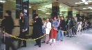 Photograph of people waiting in line at a motor vehicle office