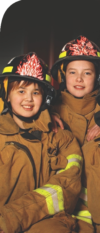 Members of the Dragon Slayers pose together at the Aniak Volunteer Fire Department.