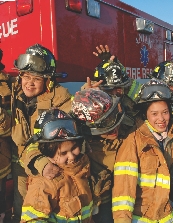 Photograph of several Dragon Slayer members wearing firefighter uniforms