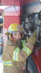 Mariah Brown practices answering a fire call.