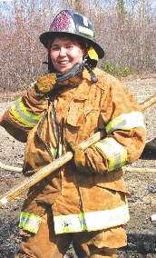 Erica Kameroff cleans up after a training fire.