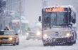 Photograph of city traffic during a snowstorm