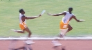 Photograph of two team mates running in a relay race