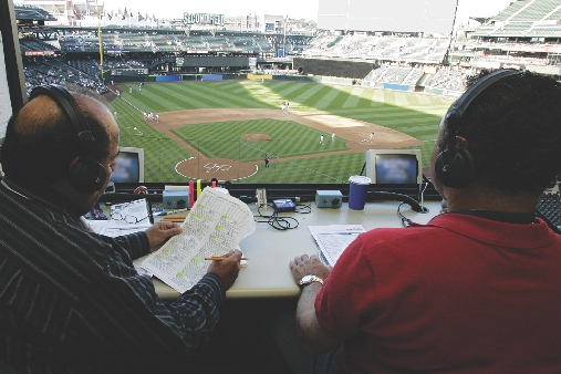 Photograph of radio announcers at a baseball game