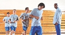 Photograph of several teenage boys in gym class