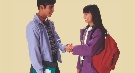 Photograph of two teenagers meeting and shaking hands