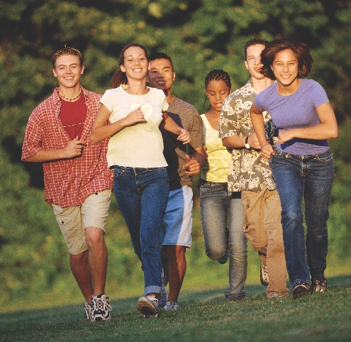 Photograph of a group of teenagers running together