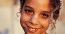 Photograph of a smiling girl's face