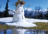 Photograph of a snowman in the sun