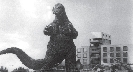 Photograph of movie scene of Godzilla attacking a city