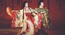 Photograph of two people in traditional Japanese dress dancing
