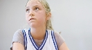 Photograph of a young basketball player looking nervous