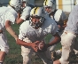 Photograph of a football team playing football