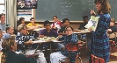 Photograph of a mixed ethnic group of boys and girls in a classroom