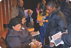 Linda Brown Thompson, left, signs autographs at the University of Michigan in 2004.