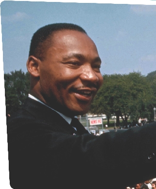 Martin Luther King, Jr., smiles and waves at the huge crowd gathered at the March on Washington.