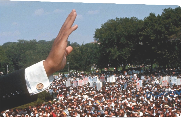 Photograph of Martin Luther King, Jr. waving to a large crowd in Washington, D.C.