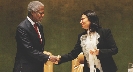 Photograph of Nelson Mandela and a woman shaking hands