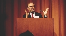 Photograph of a speaker at a podium