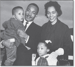 Martin Luther King, Jr., with his wife, Coretta, and two of their four children, Marty and Yoki.