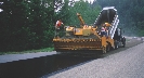 Photograph of a machine paving a road