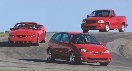 Photograph of three different vehicles, each one is red in color