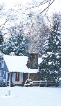 Photograph of a house with snow all around