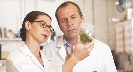 Photograph of two scientists in white lab coats