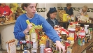 Photograph of people gathering foods at a food pantry