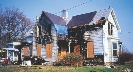 Photograph of a home destroyed by a fire