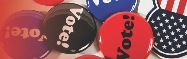 Photograph of buttons with the word “Vote” on them