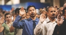 Photograph of people at a swearing-in ceremony for U.S. citizenship