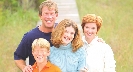 Photograpah of a family with light-colored hair