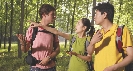 Photograph of hikers in a woods. One hiker is pointing.