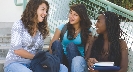 Photograph of a group of teenage girls having a conversation