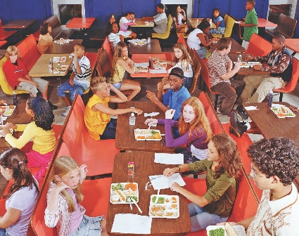 Students talk to each other at lunchtime.