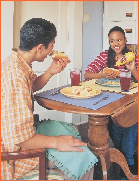 Kim and Mitch eat lunch.