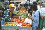 Photograph of people at an outdoor farmer's market