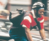 Photograph of a bicycle messenger in motion